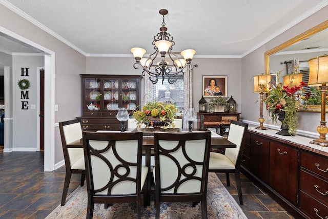 dining space with crown molding, stone finish floor, a textured ceiling, a chandelier, and baseboards