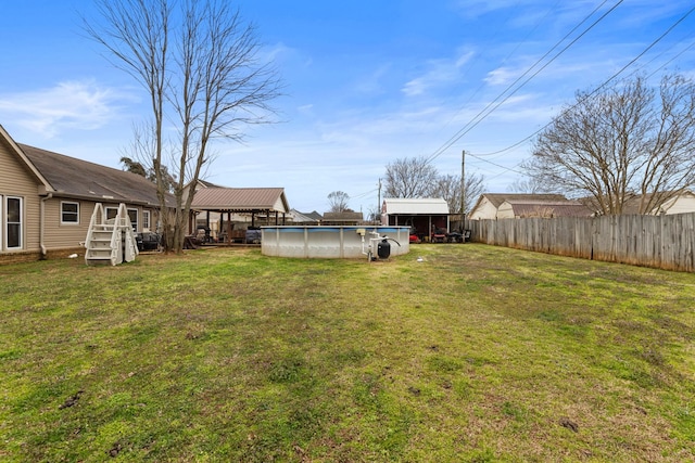 view of yard with a fenced backyard and a fenced in pool