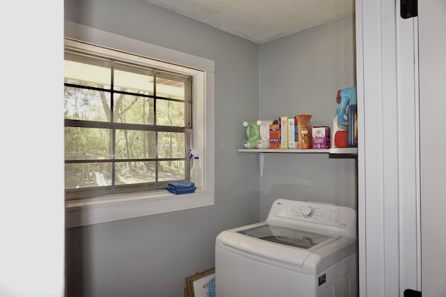 clothes washing area featuring washer / clothes dryer