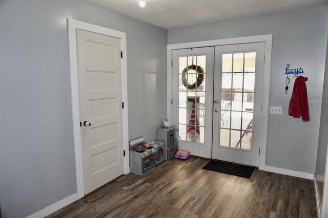 doorway to outside with dark hardwood / wood-style floors and french doors