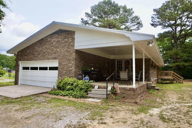 view of front of home with a garage and covered porch