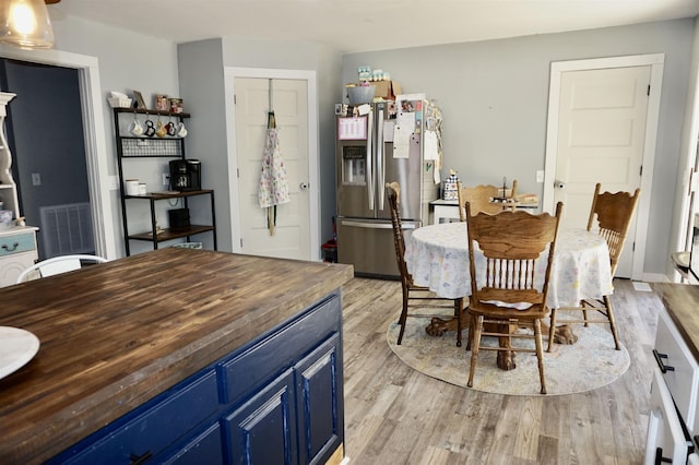 dining space with light wood-type flooring