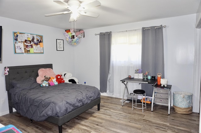 bedroom featuring hardwood / wood-style floors and ceiling fan