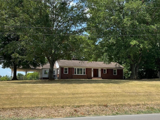 ranch-style home with a front lawn