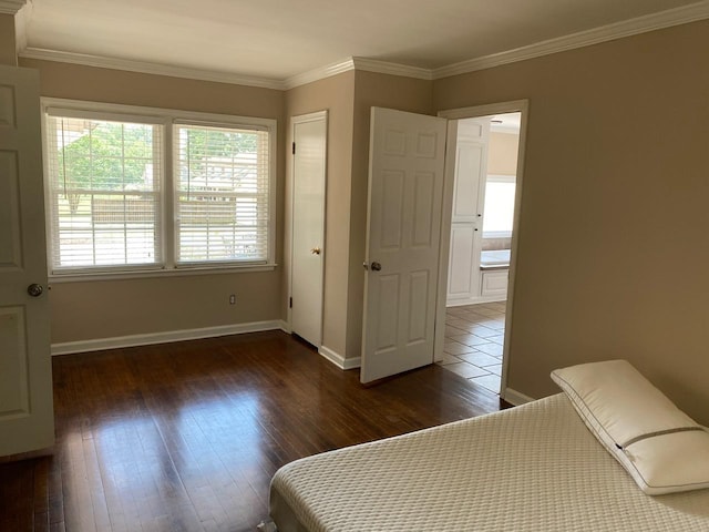 bedroom featuring dark hardwood / wood-style floors and ornamental molding