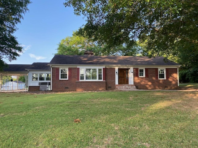 ranch-style house featuring a front yard