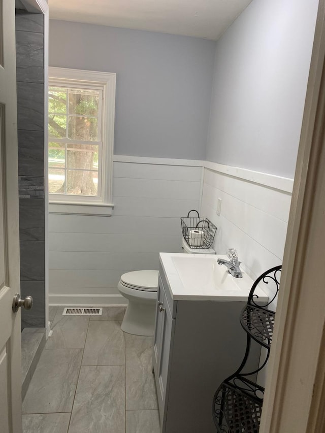 bathroom featuring vanity and toilet