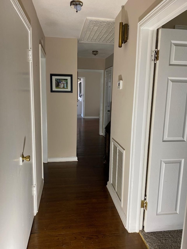 hall with dark hardwood / wood-style floors