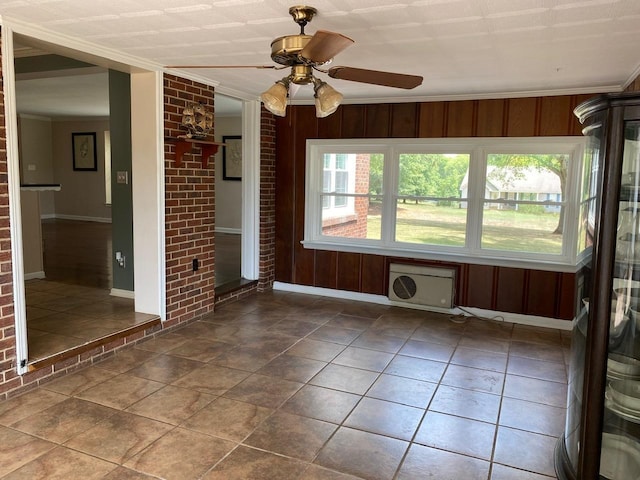 tiled spare room featuring wooden walls, plenty of natural light, and ornamental molding