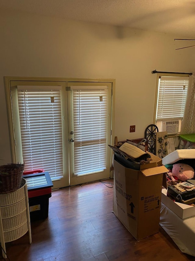 interior space featuring cooling unit and dark hardwood / wood-style flooring