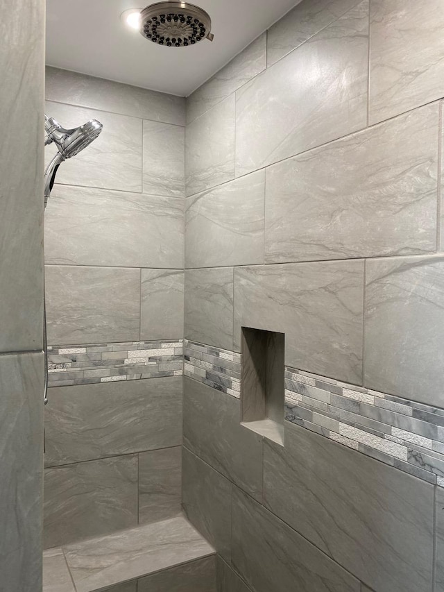 bathroom with tiled shower