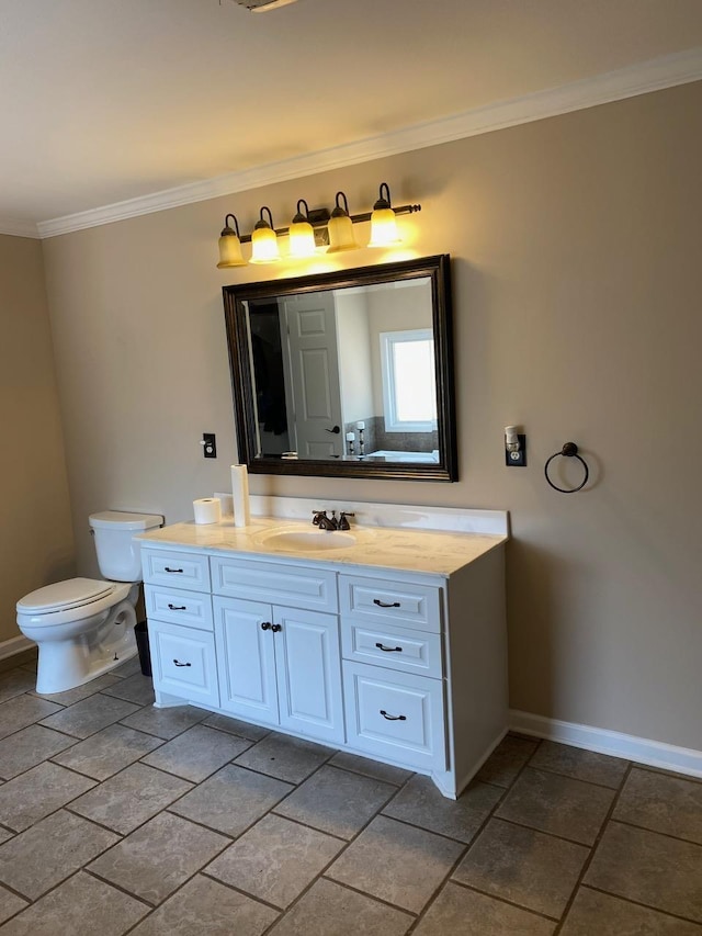 bathroom with vanity, toilet, and crown molding