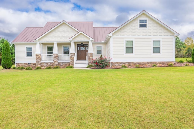 view of front of home with a front yard and covered porch