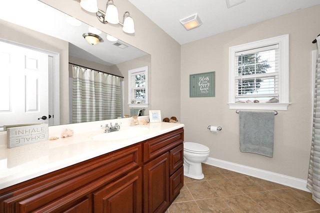 bathroom with an inviting chandelier, tile patterned floors, toilet, vanity, and a shower with shower curtain