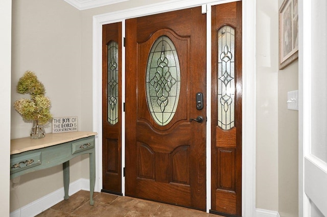 foyer entrance featuring ornamental molding