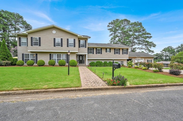 split level home featuring a front yard