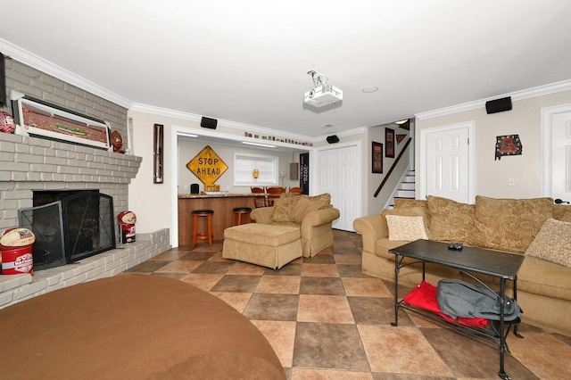 living room featuring crown molding and a brick fireplace