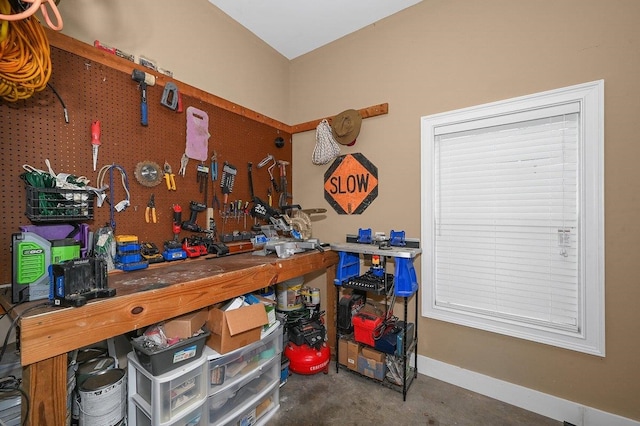 interior space featuring a workshop area and concrete floors