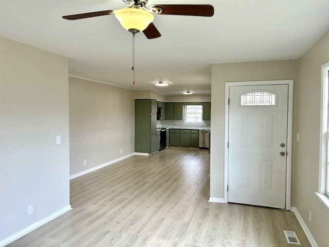 entrance foyer with light wood-type flooring, visible vents, and baseboards