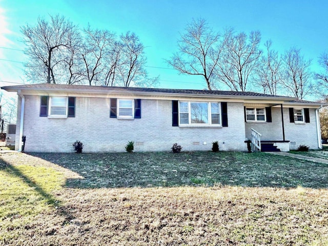 ranch-style house with crawl space, brick siding, and a front lawn