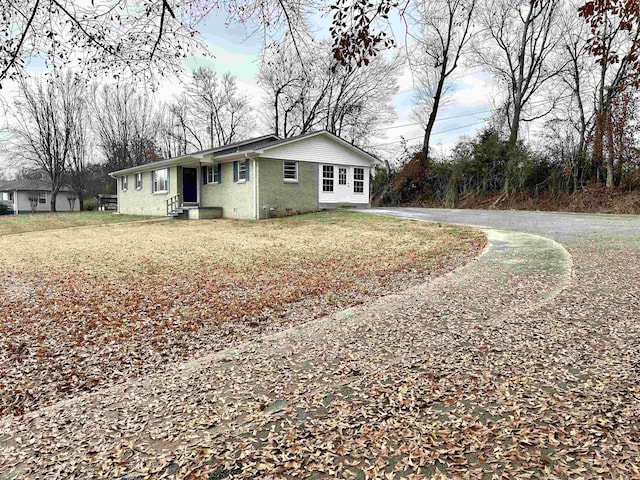 view of property exterior with a lawn