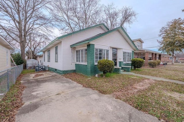 bungalow-style house with a front yard