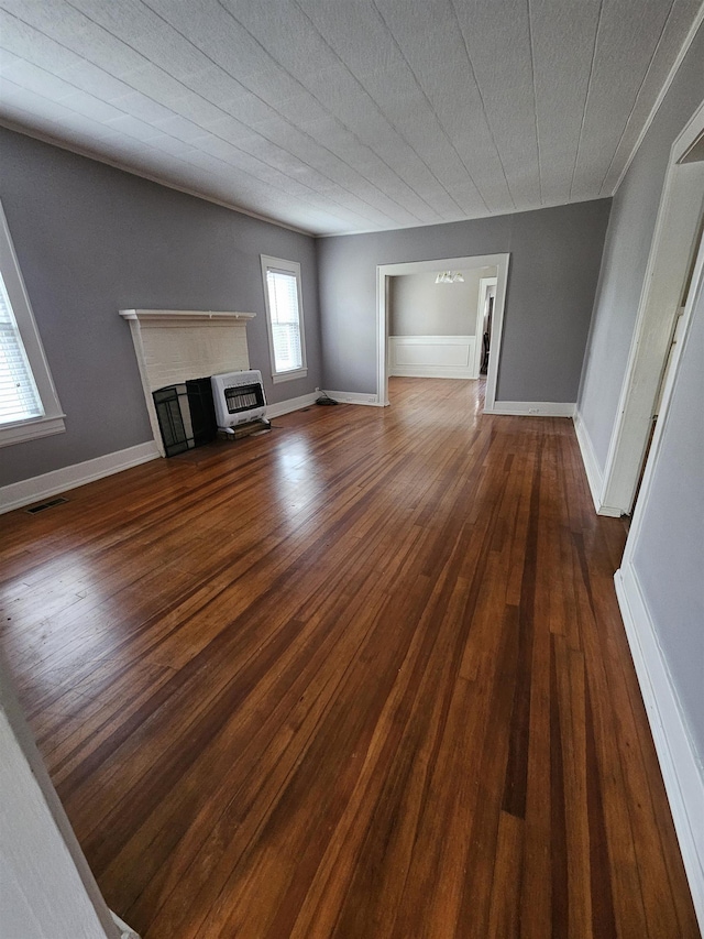 unfurnished living room featuring dark wood-type flooring