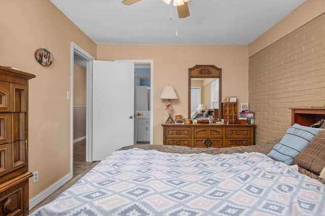 bedroom featuring ceiling fan and connected bathroom