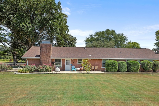 ranch-style home featuring a patio area and a front yard