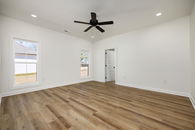 unfurnished room featuring ceiling fan and wood-type flooring