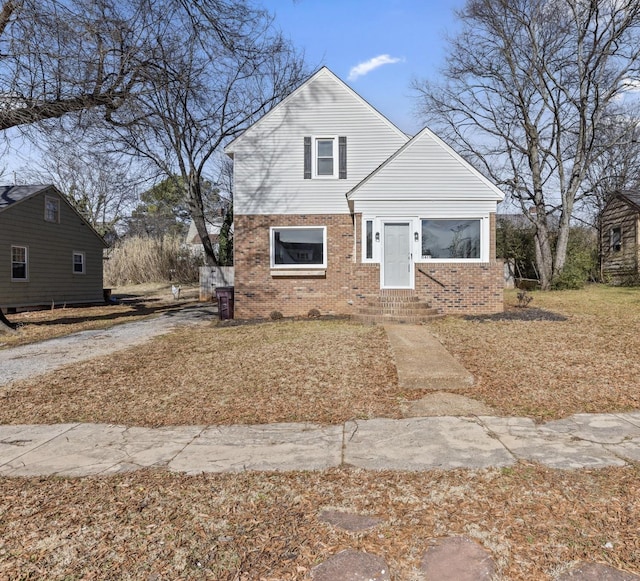 bungalow-style house featuring brick siding