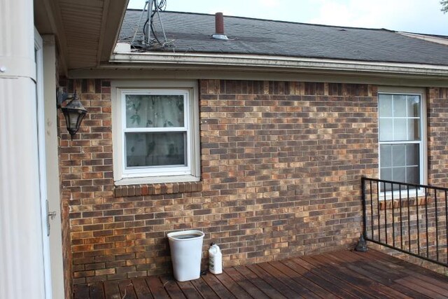 view of property exterior with a deck