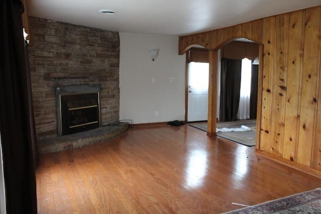 unfurnished living room with a fireplace and hardwood / wood-style flooring