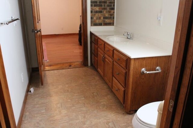 bathroom with vanity and toilet