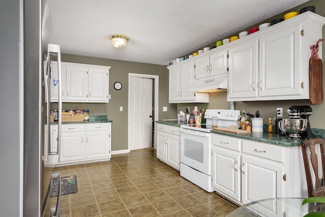 kitchen featuring white electric range oven, custom range hood, a textured ceiling, white cabinets, and stainless steel refrigerator