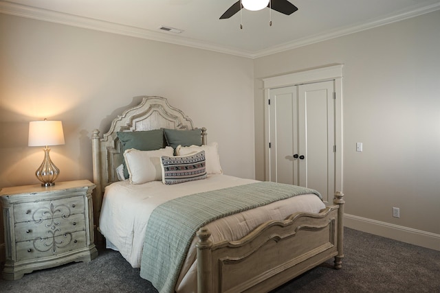 bedroom with a closet, dark carpet, ceiling fan, and ornamental molding