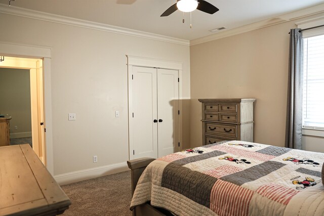 carpeted bedroom featuring multiple windows, ceiling fan, and ornamental molding