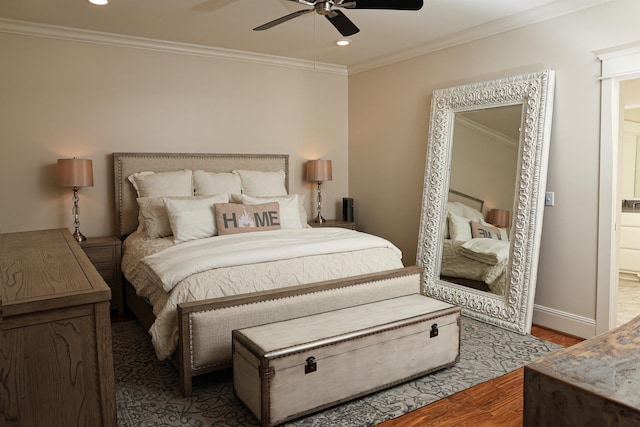 bedroom featuring ceiling fan, wood-type flooring, and ornamental molding