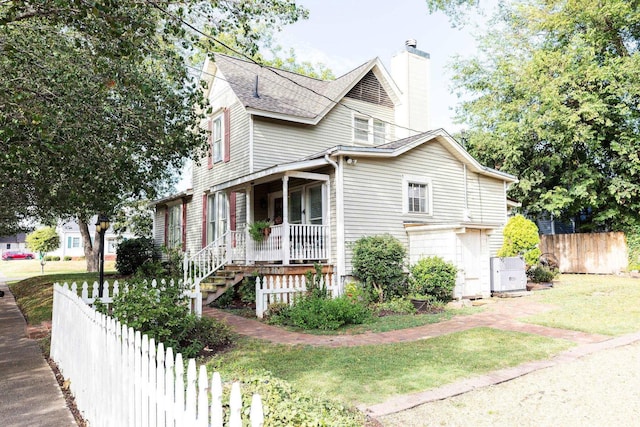 view of front of property with a front yard and a porch