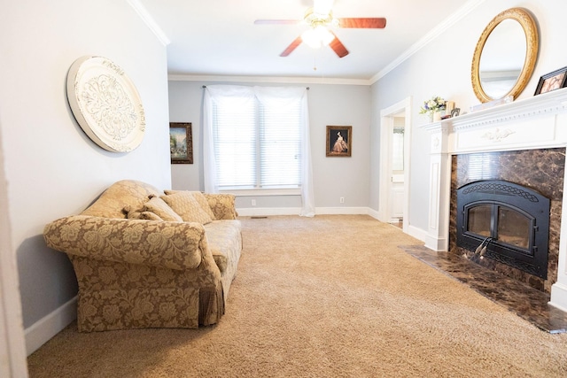 carpeted living room with crown molding, a high end fireplace, and ceiling fan