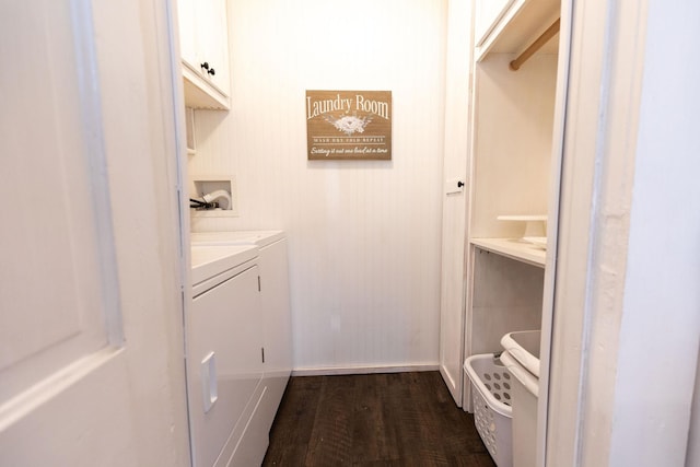 laundry room featuring cabinets, washer and clothes dryer, and dark wood-type flooring