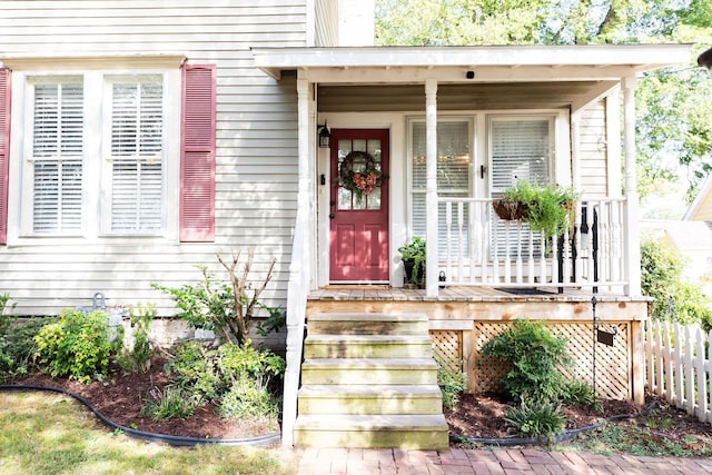 doorway to property with covered porch