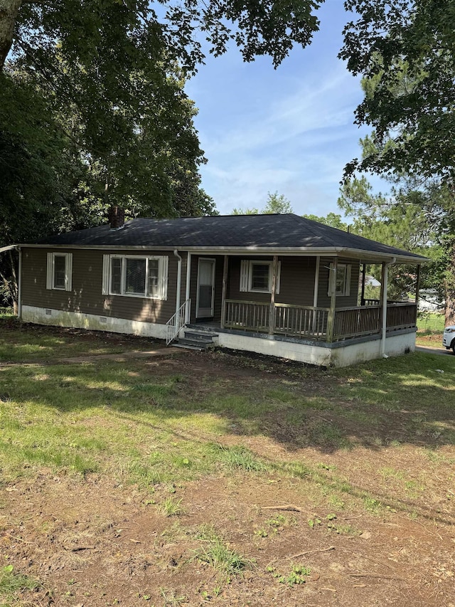  - view of front facade with covered porch and a front lawn