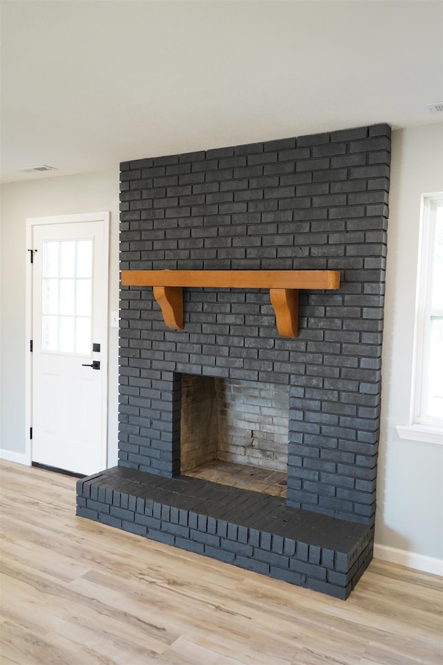 room details featuring hardwood / wood-style floors and a fireplace