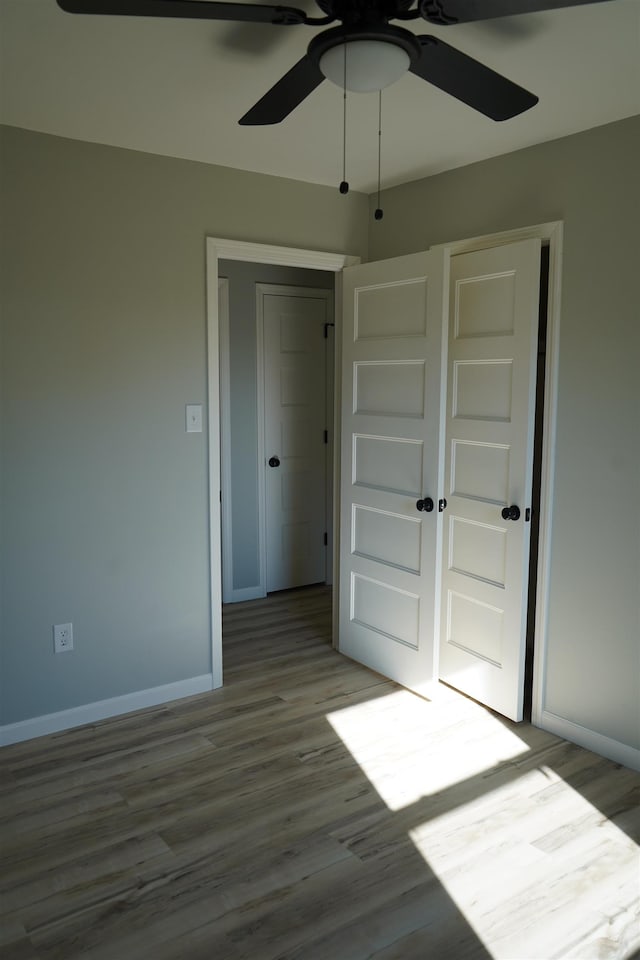 interior space featuring light hardwood / wood-style flooring and ceiling fan