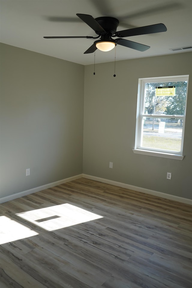 unfurnished room featuring ceiling fan and hardwood / wood-style floors