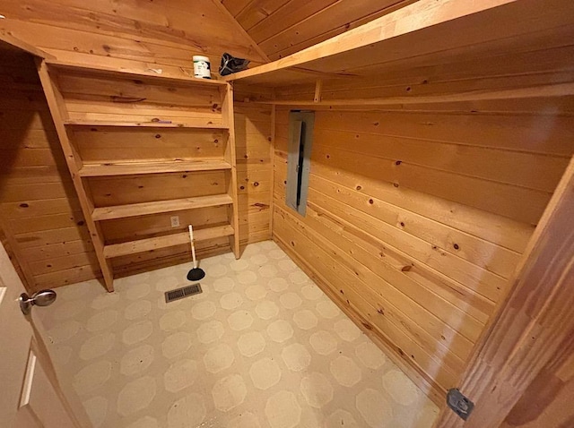  - interior space with wooden walls and tile patterned floors
