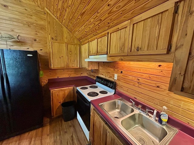  - kitchen with freestanding refrigerator, electric stove, wood walls, vaulted ceiling, and under cabinet range hood