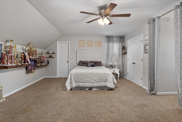 carpeted bedroom featuring ceiling fan, baseboards, and vaulted ceiling