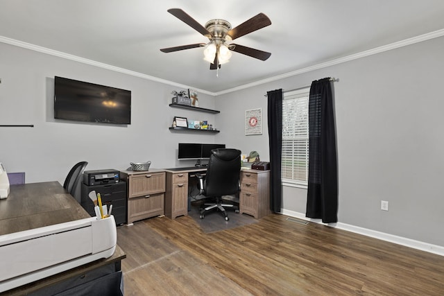 home office featuring ceiling fan, baseboards, dark wood finished floors, and crown molding